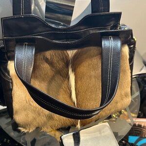 Diane Gail has made one of a kind this fur bag is real good leather Classey